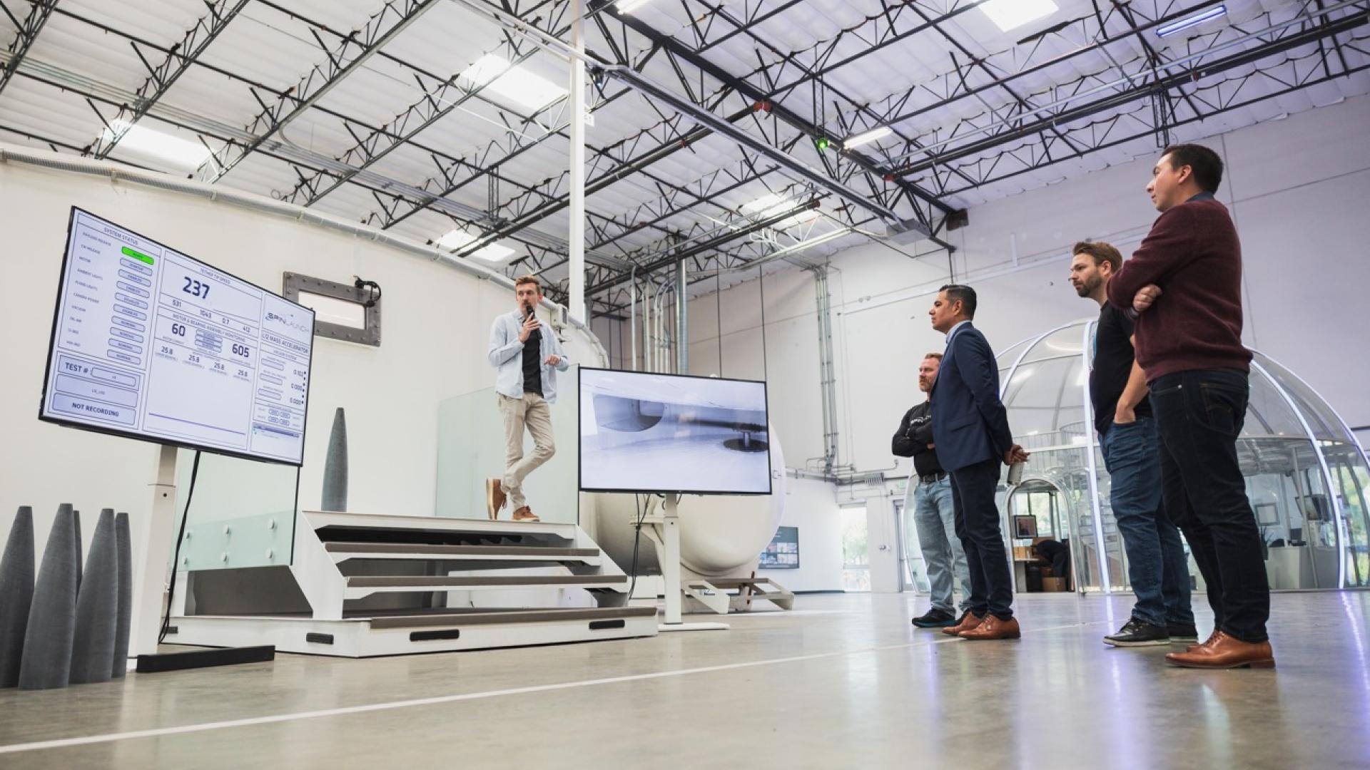 Congressman Garcia watching SpinLaunch perform a test of their accelerator at their Long Beach headquarters in Douglas Park