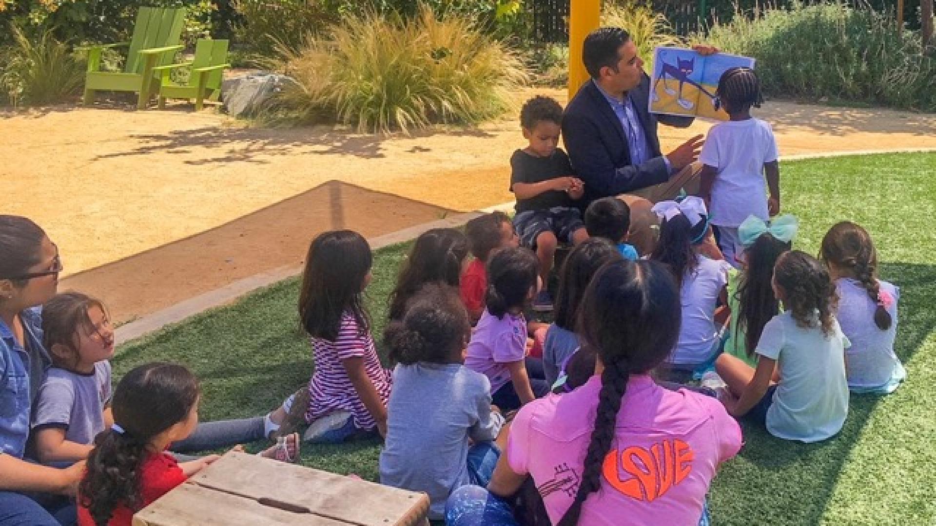 Congressman Garcia reading to children