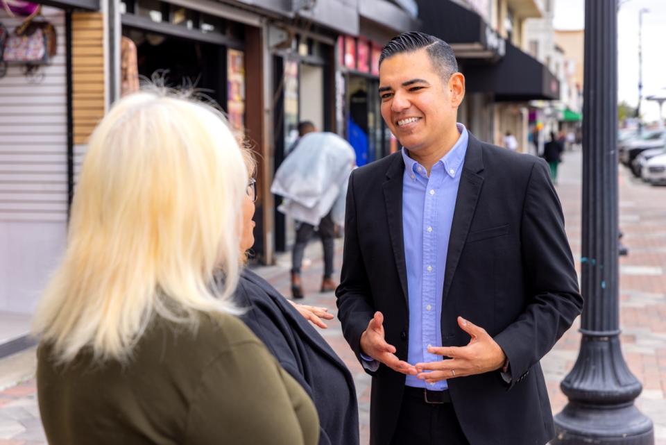 Congressman Garcia talking to a constituent 